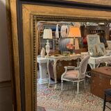 Giled and black fireplace mirror