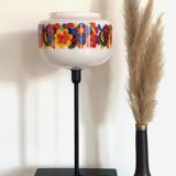 Table lamp with a vintage “flower power” glass globe and a gold base