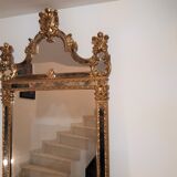 Mirror with parecloses