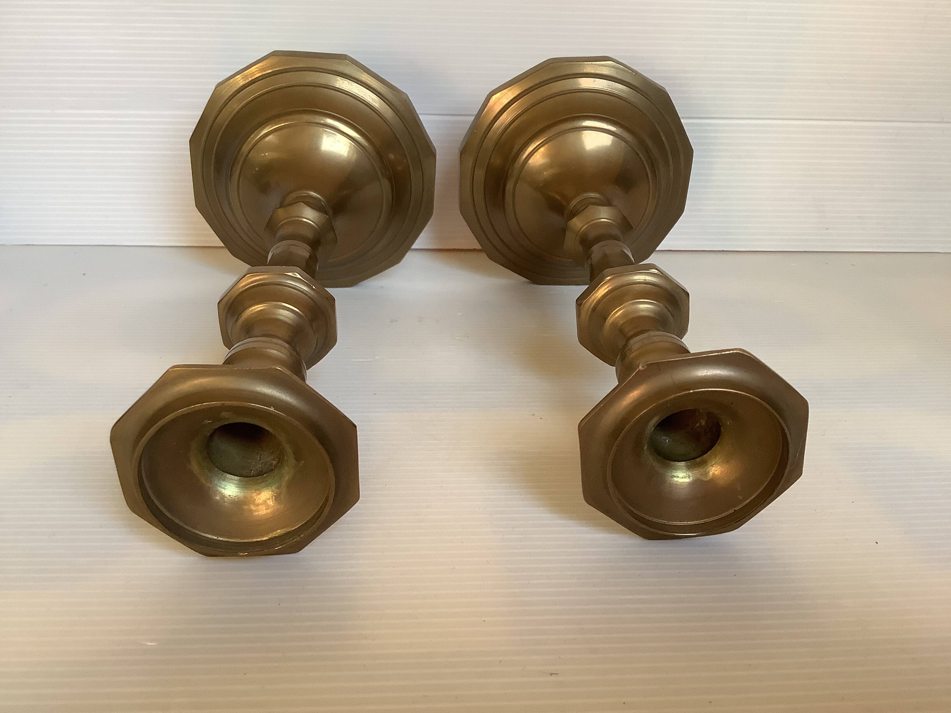 Four brass candle holders