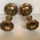 Four brass candle holders