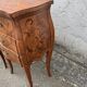 Pair of bedside tables with bombé shape, marquetry, and bronze in Louis XV style.