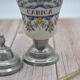Old carica pharmacy apothecary pot with lid and tin foot