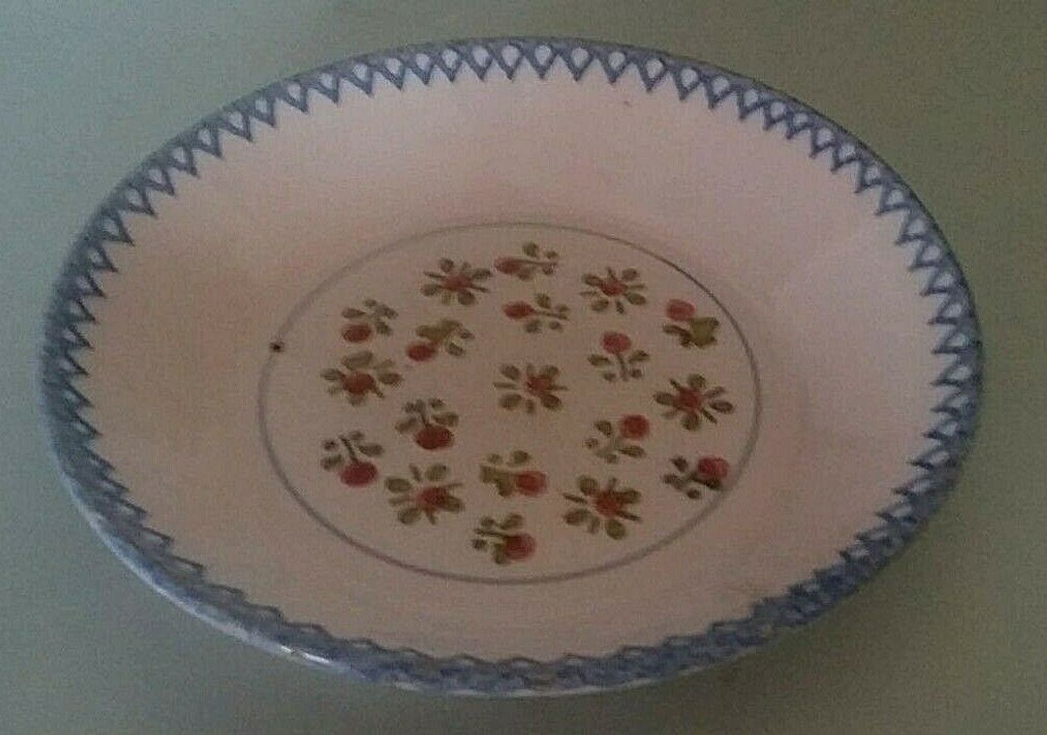 Hollow plate in earthenware, early twentieth century