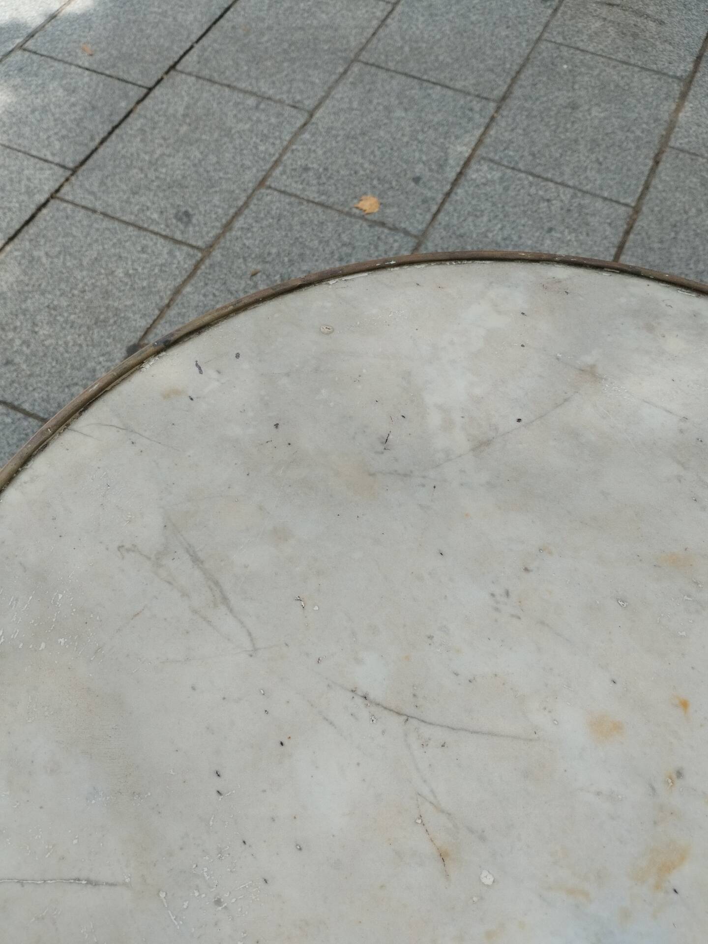 Old bistro table with marble top and cast iron base.