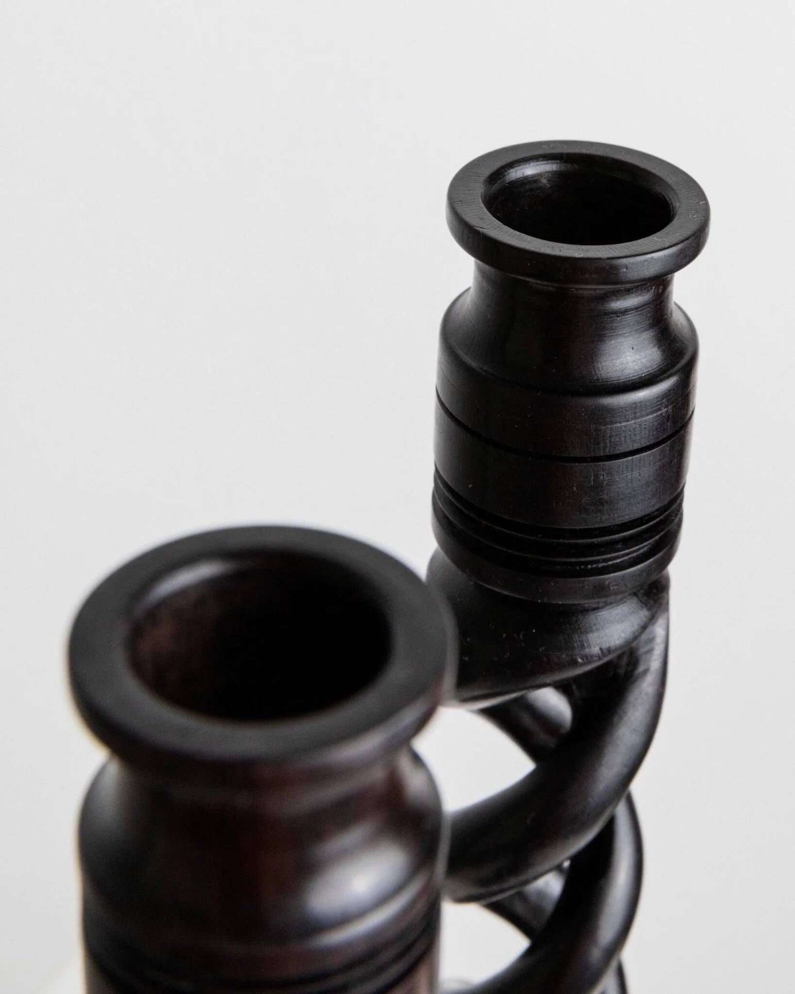 Set of 2 vintage dark wood candlesticks, twisted design, Italy, 1970s.