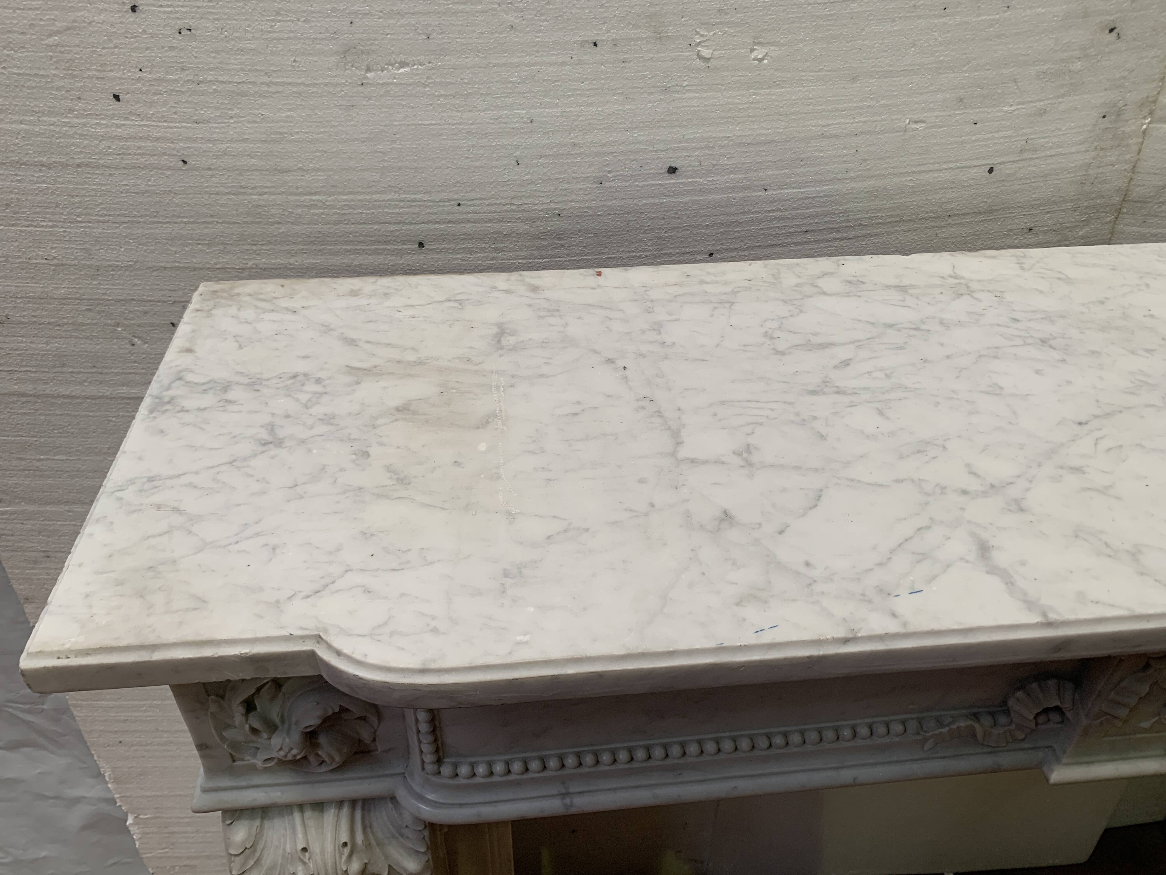 Louis XVI style fireplace in white Carrara marble, 19th century