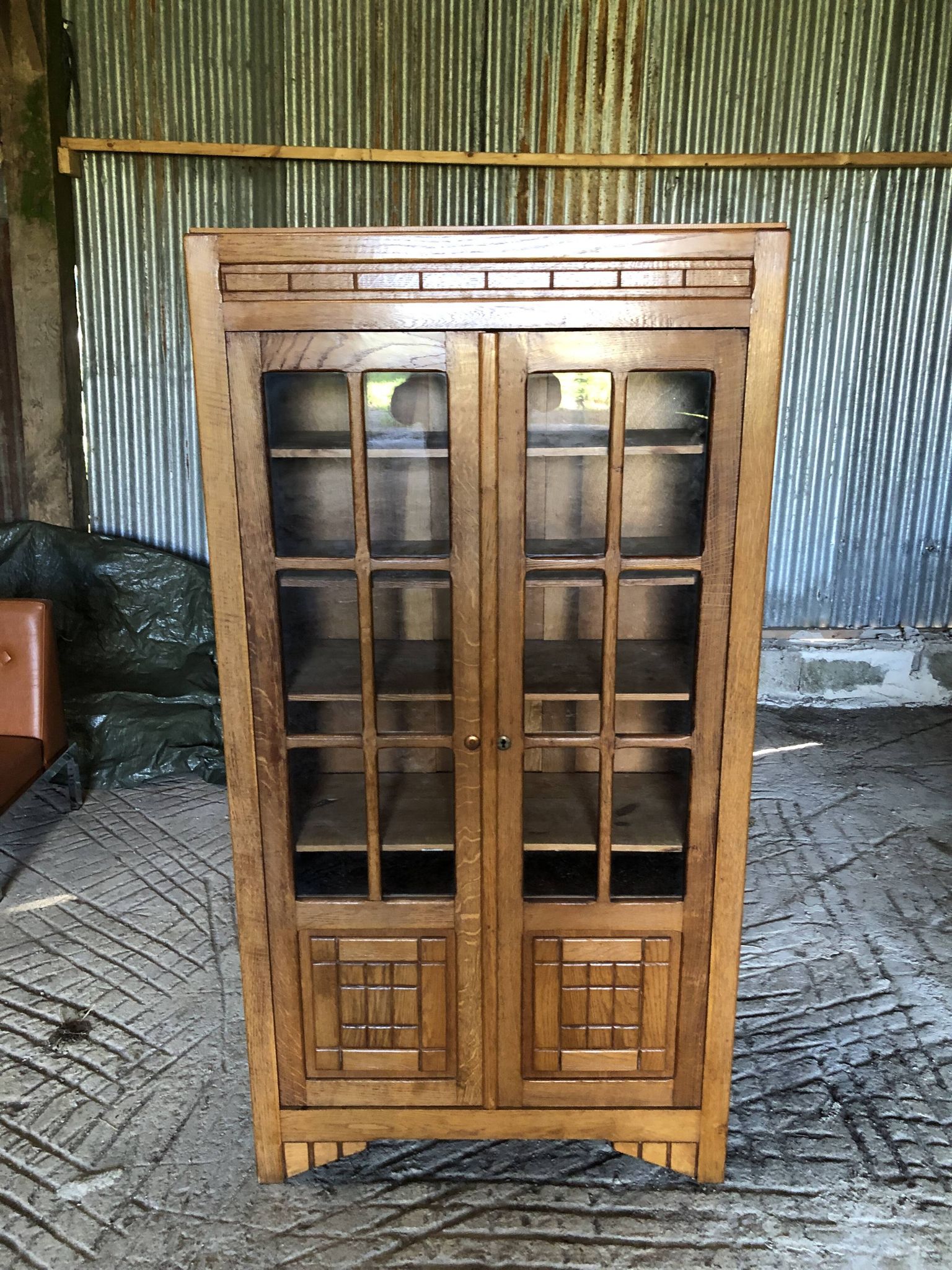 Vintage oak bookcase from the reconstruction period with 2 doors with small panes.