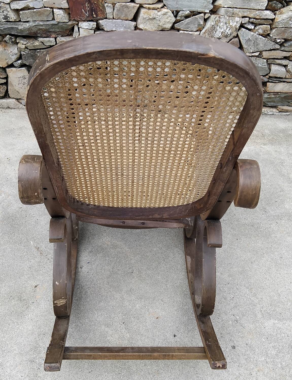 Vintage wooden and cane rocking chair
