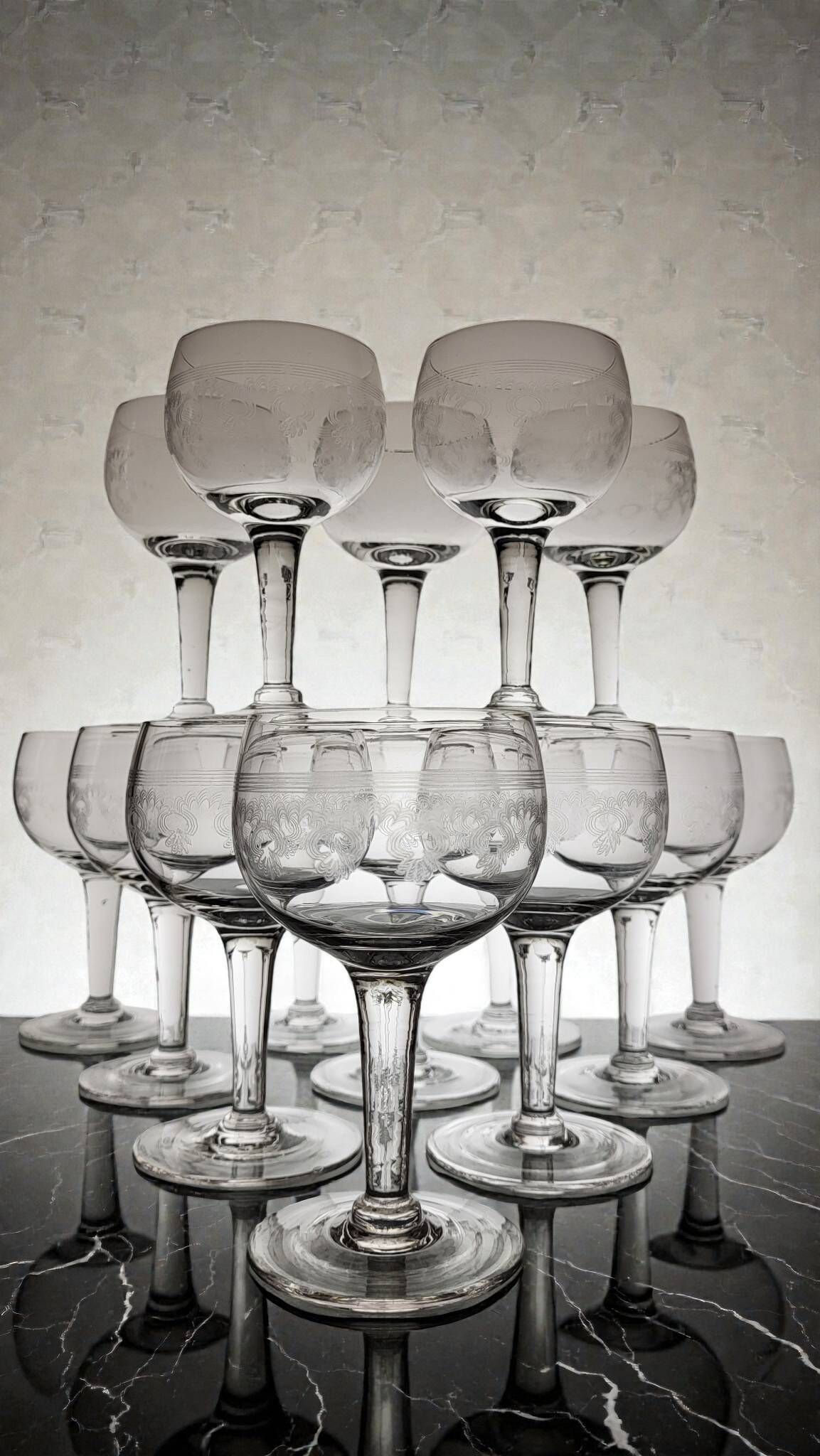 9 guilloché wine glasses, early 20th century.