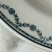 Set of 12 deep plates Saint Amand with floral garland decoration.