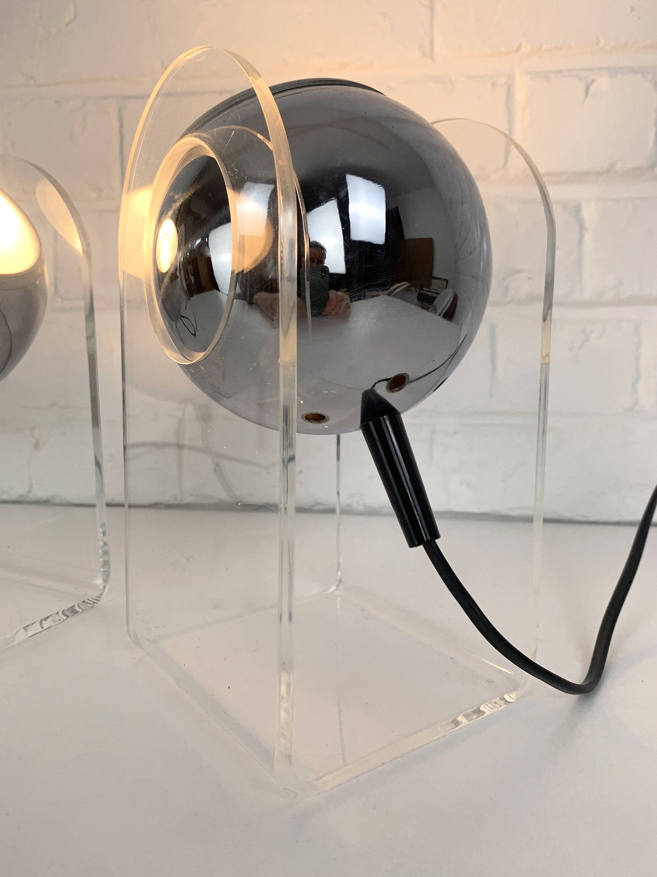 Pair of space age chrome plexiglass sphere table lamps from the 70s