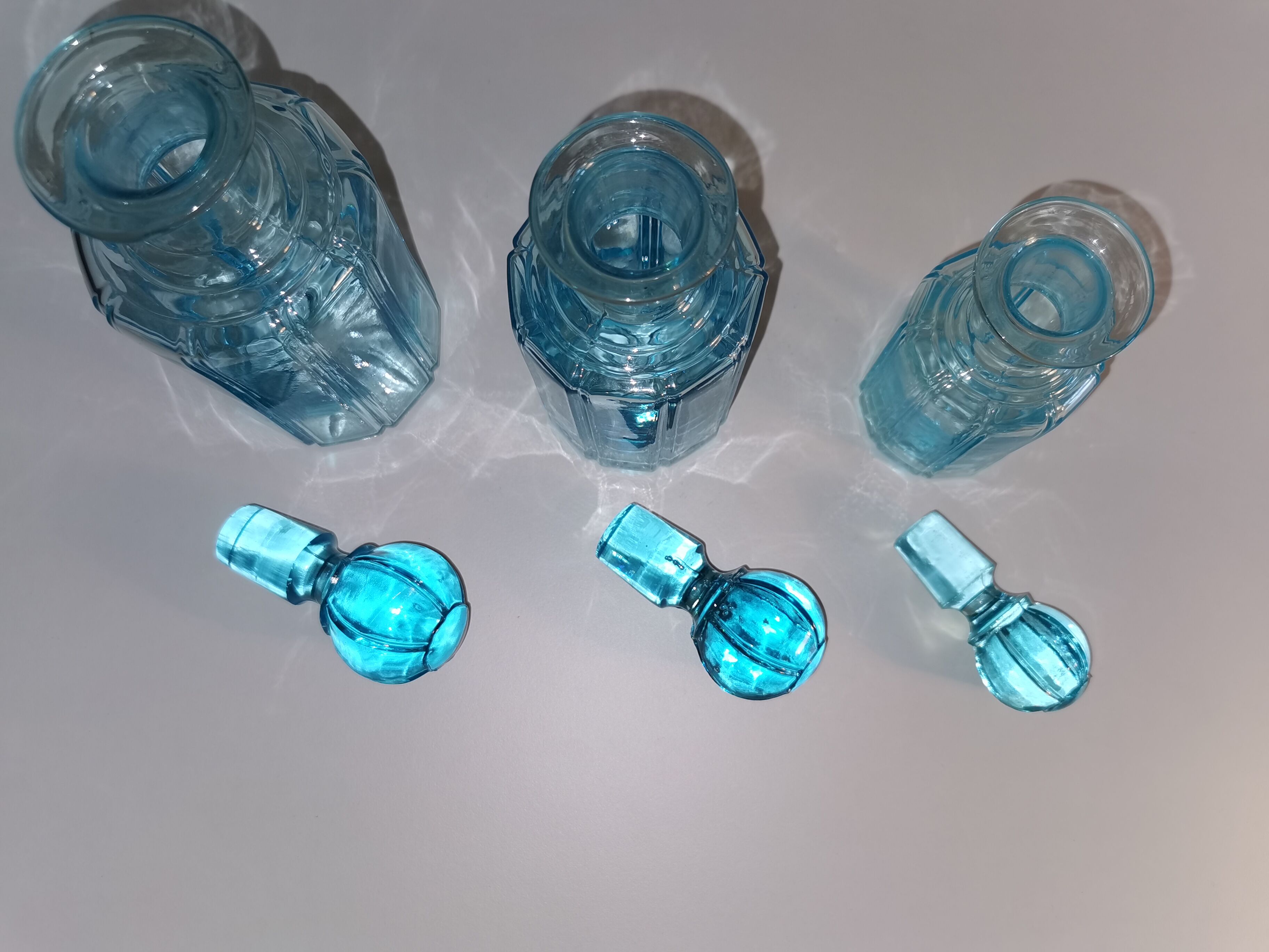 Trilogy of old blue glass bottles