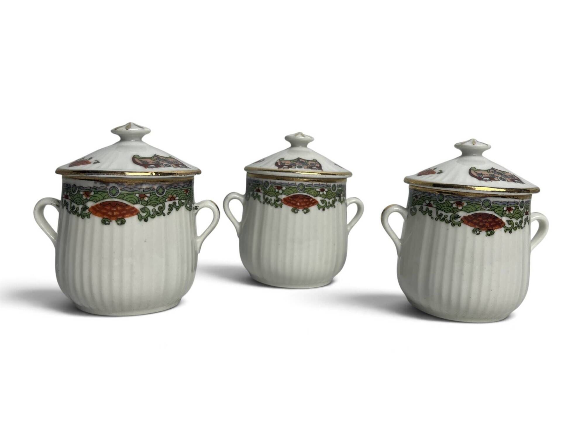 Set of three ribbed porcelain cream pots, 20th century.