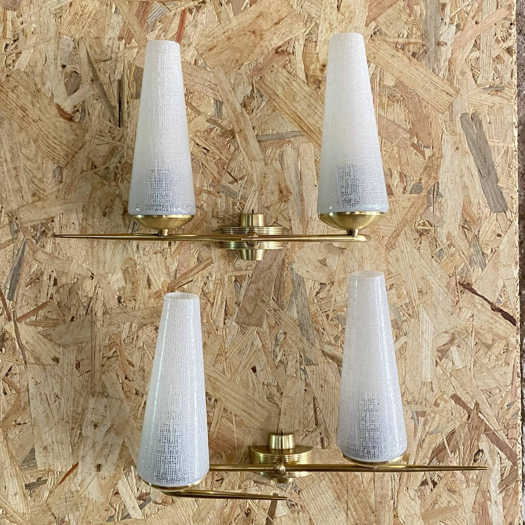 Pair of vintage double wall lights in brass with white ribbed glass tulips.