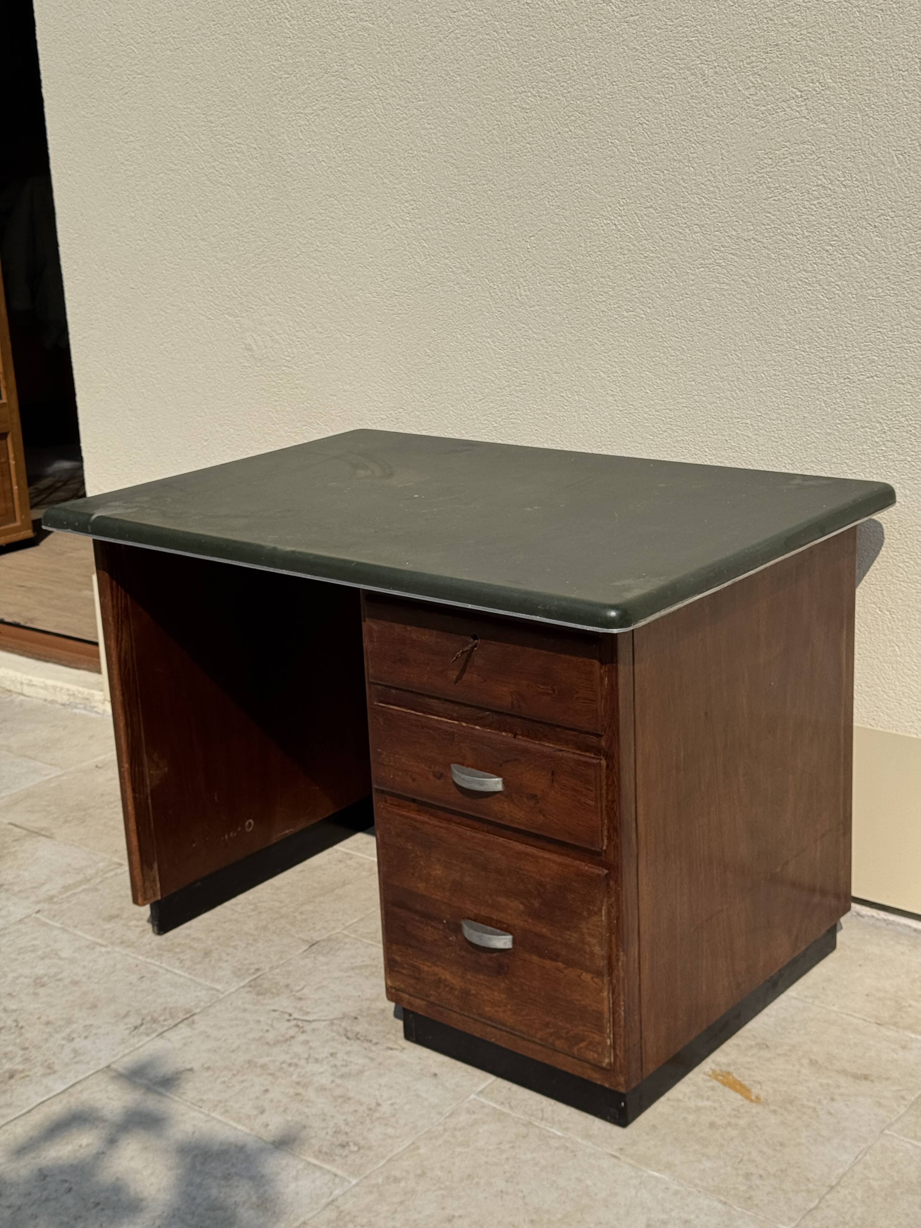 Modernist desk in wood and green moleskin upholstery