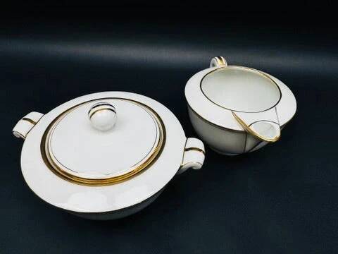 Limoges porcelain A. Vignaud sugar bowl and milk jug with gold trim