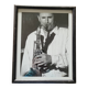 Framed and signed photo of saxophonist musician