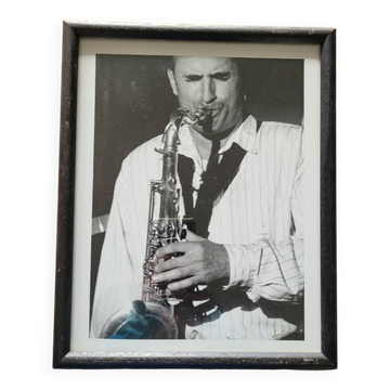 Framed and signed photo of saxophonist musician