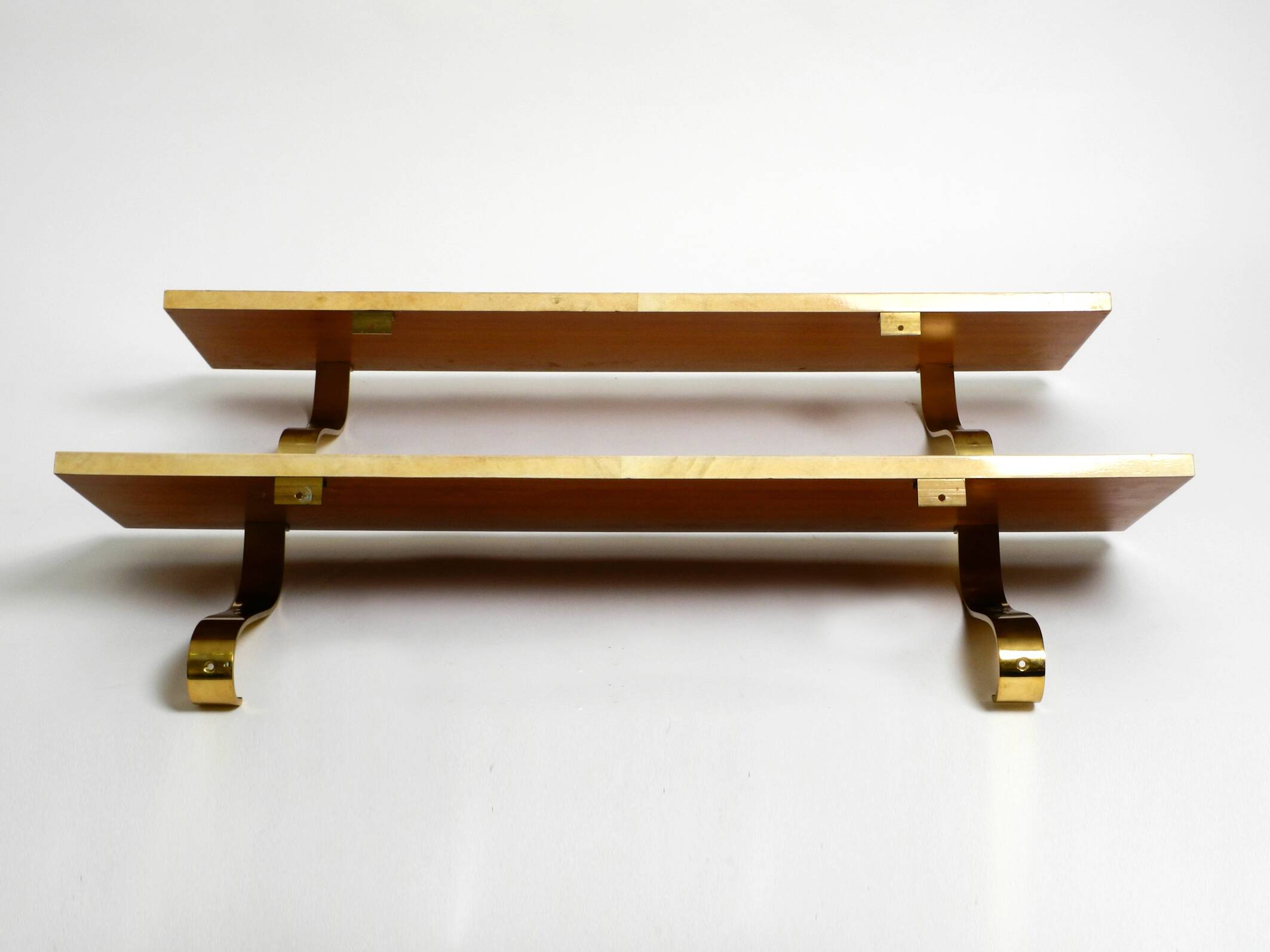 Two 1960s large Aldo Tura shelves made of wood and goatskin in beige