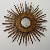 Sun Mirror called Witch's Mirror in gilded wood from the 20s