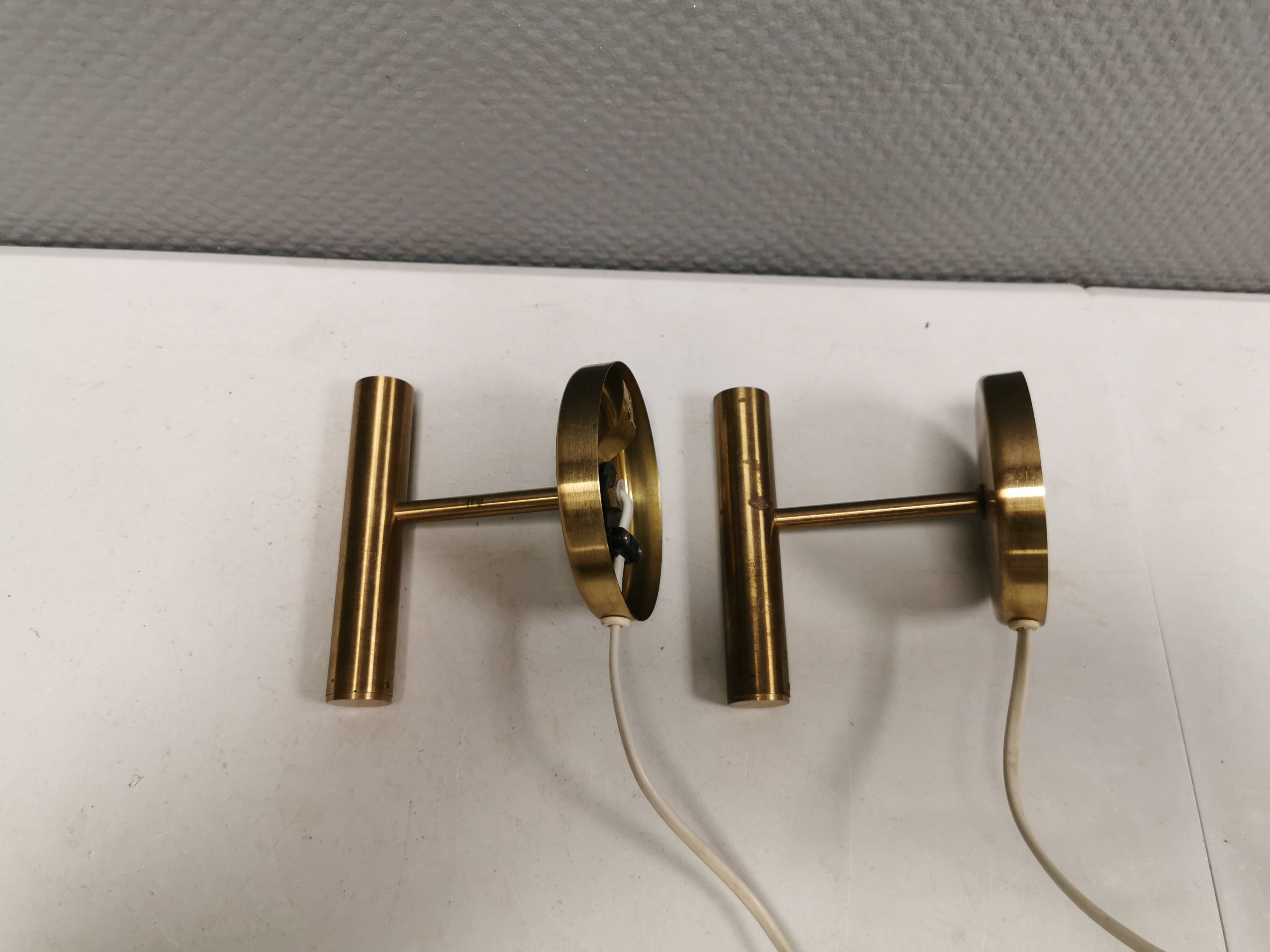 A set of stylish brass wall lamps from Danish Darø