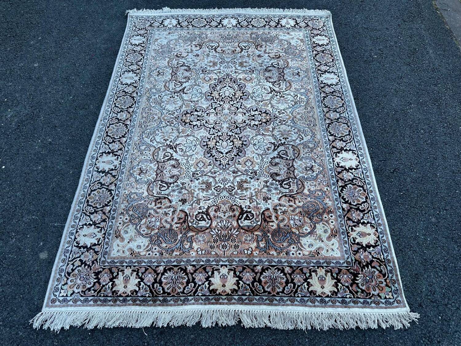 Hand-knotted Persian silk rug