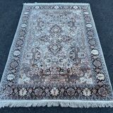 Hand-knotted Persian silk rug
