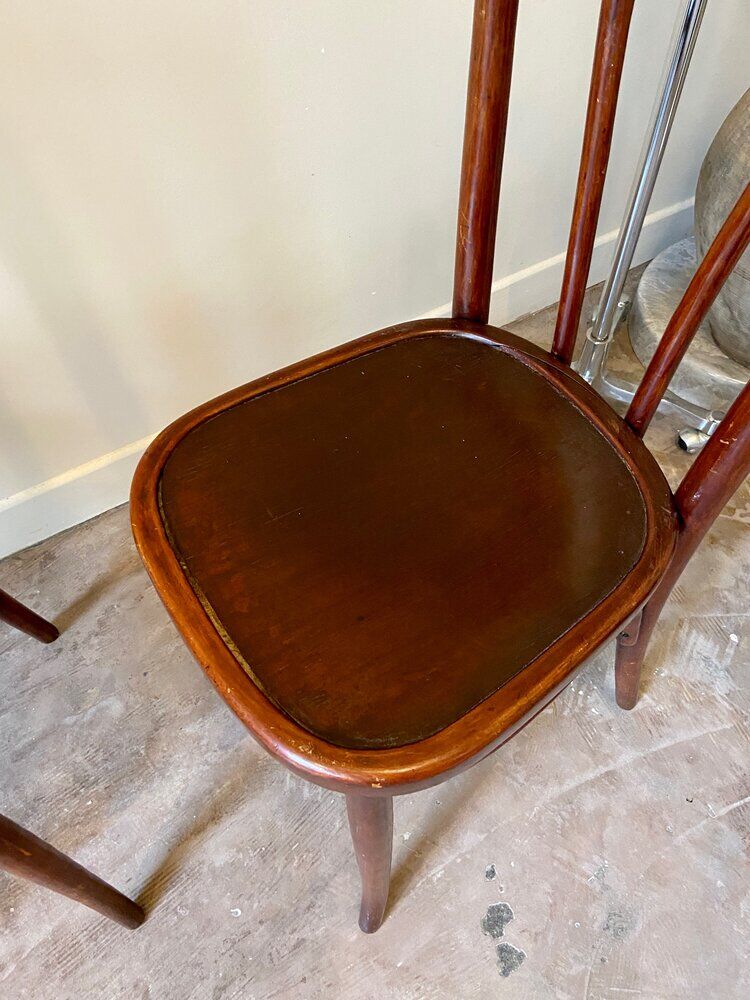 2 bistro chairs in arched and dark wood