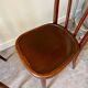 2 bistro chairs in arched and dark wood