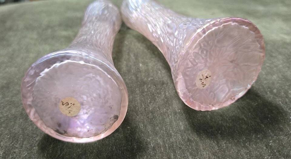 Pair of iridescent glass vases with relief decoration reminiscent of plant motifs.
