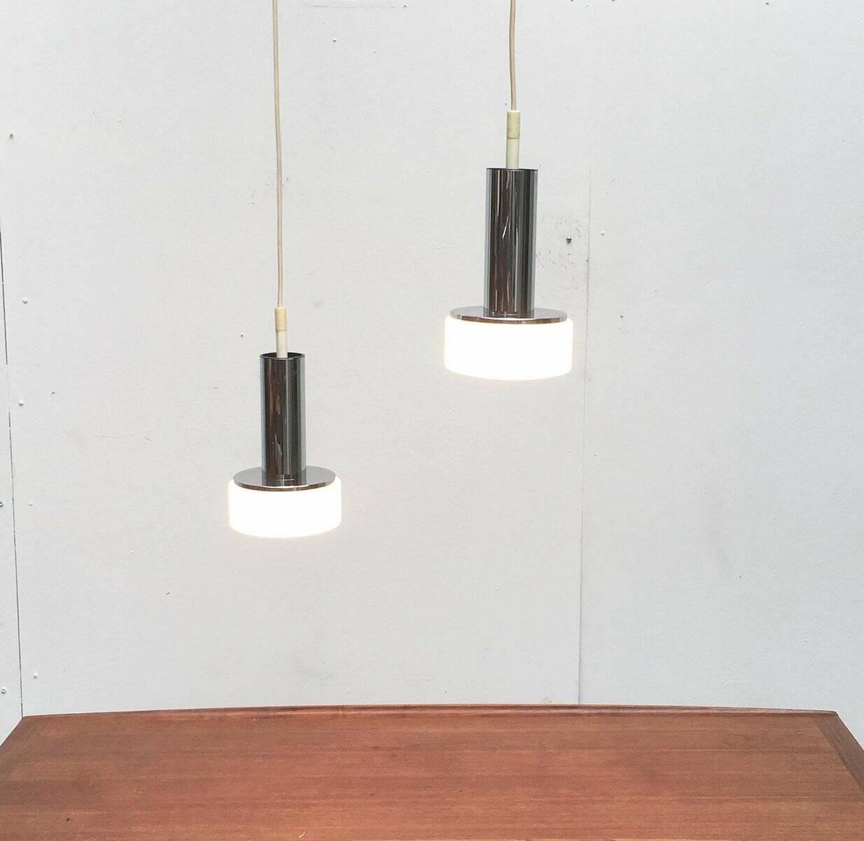Suspended glass and chrome lamps model P105 German Mid-Century Space Age from the 1960s by Staff, set of 2.