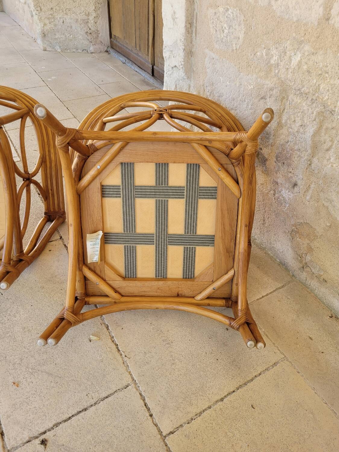 Two large rattan armchairs