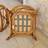 Two large rattan armchairs