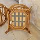 Two large rattan armchairs