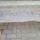 French country style cast iron bench with old rustic wooden plank