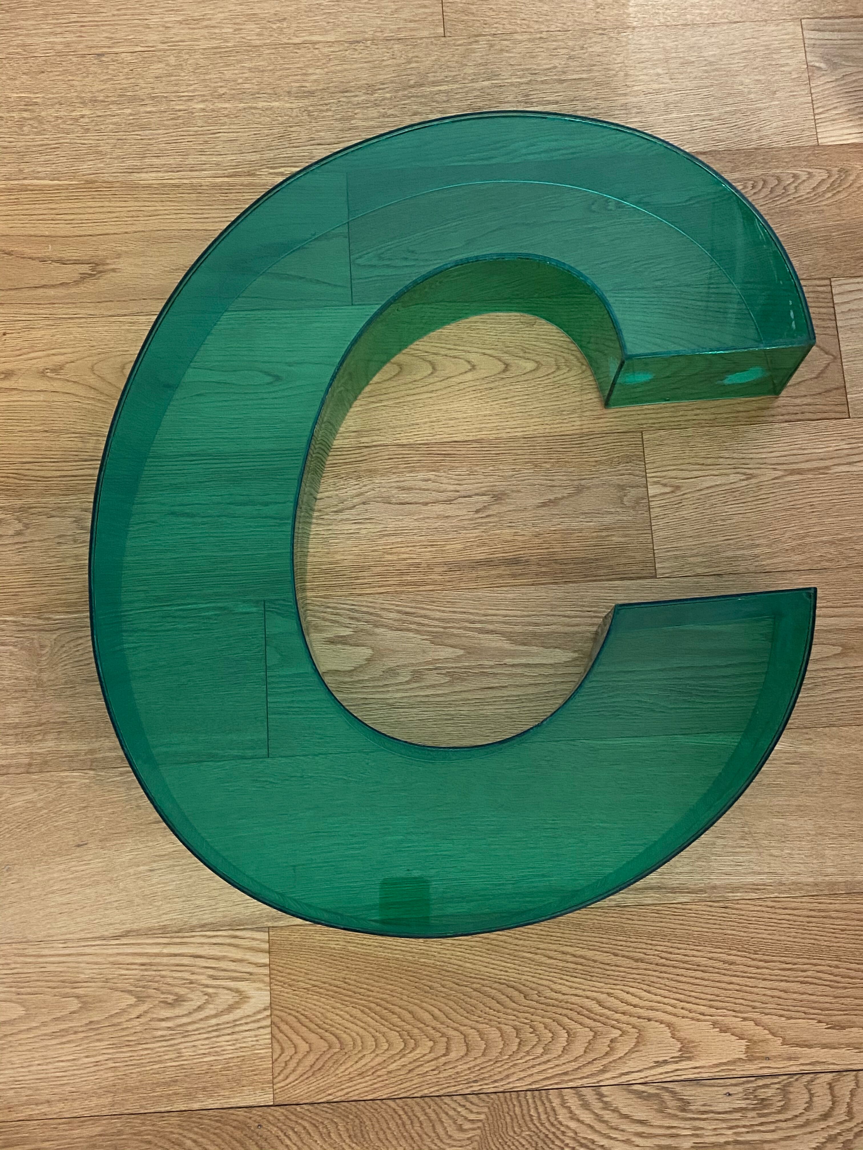 Letter signs C in transparent plexiglass