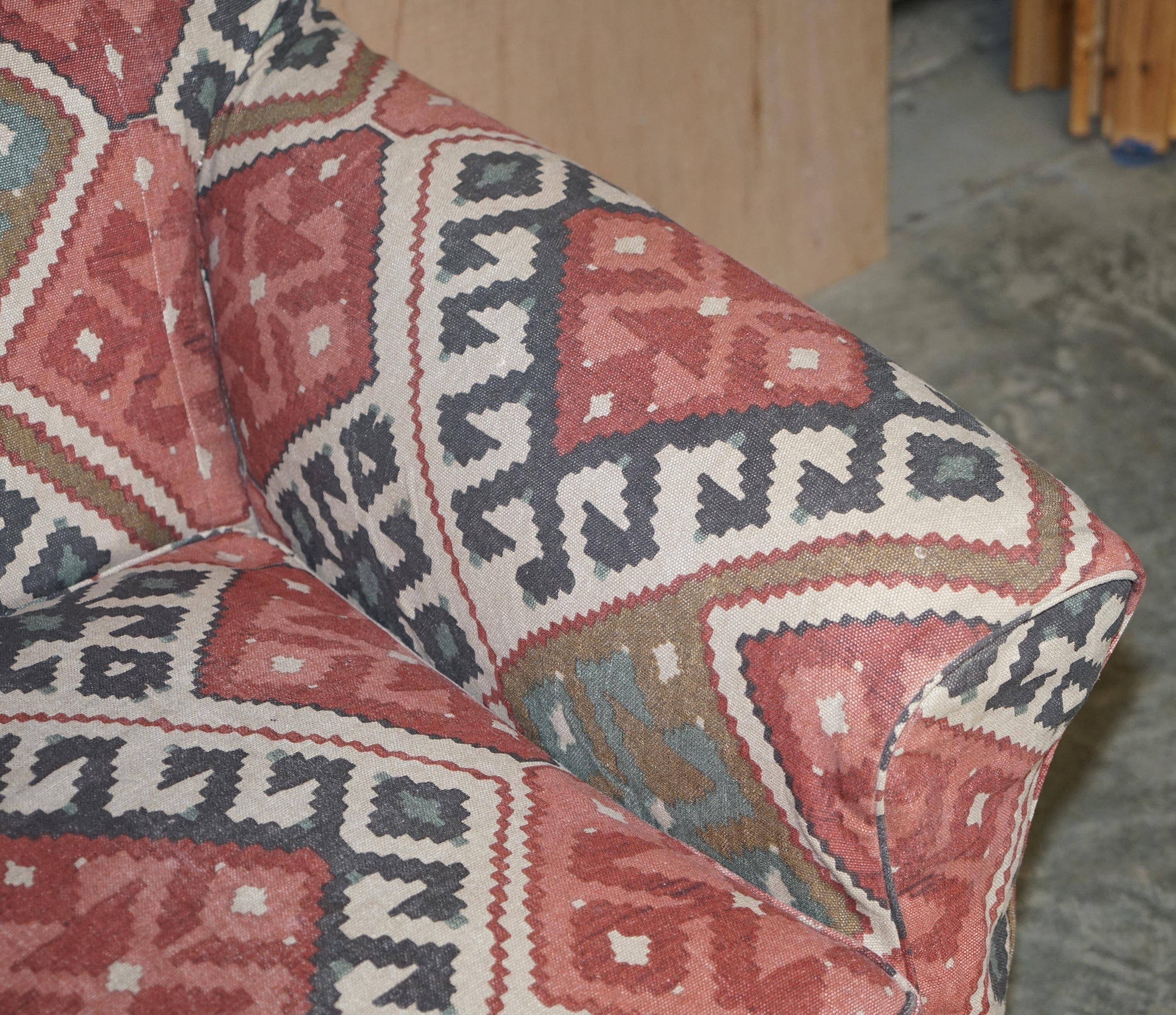Victorian canapé upholstered in Kilim with turned mahogany legs.