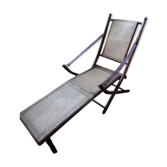 Chaise longue en chêne cannage accoudoir cuir de style coloniale