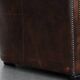 Brown Chesterfield armchair made of cowhide leather in English style