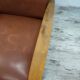 Vintage armchair in wood and imitation leather