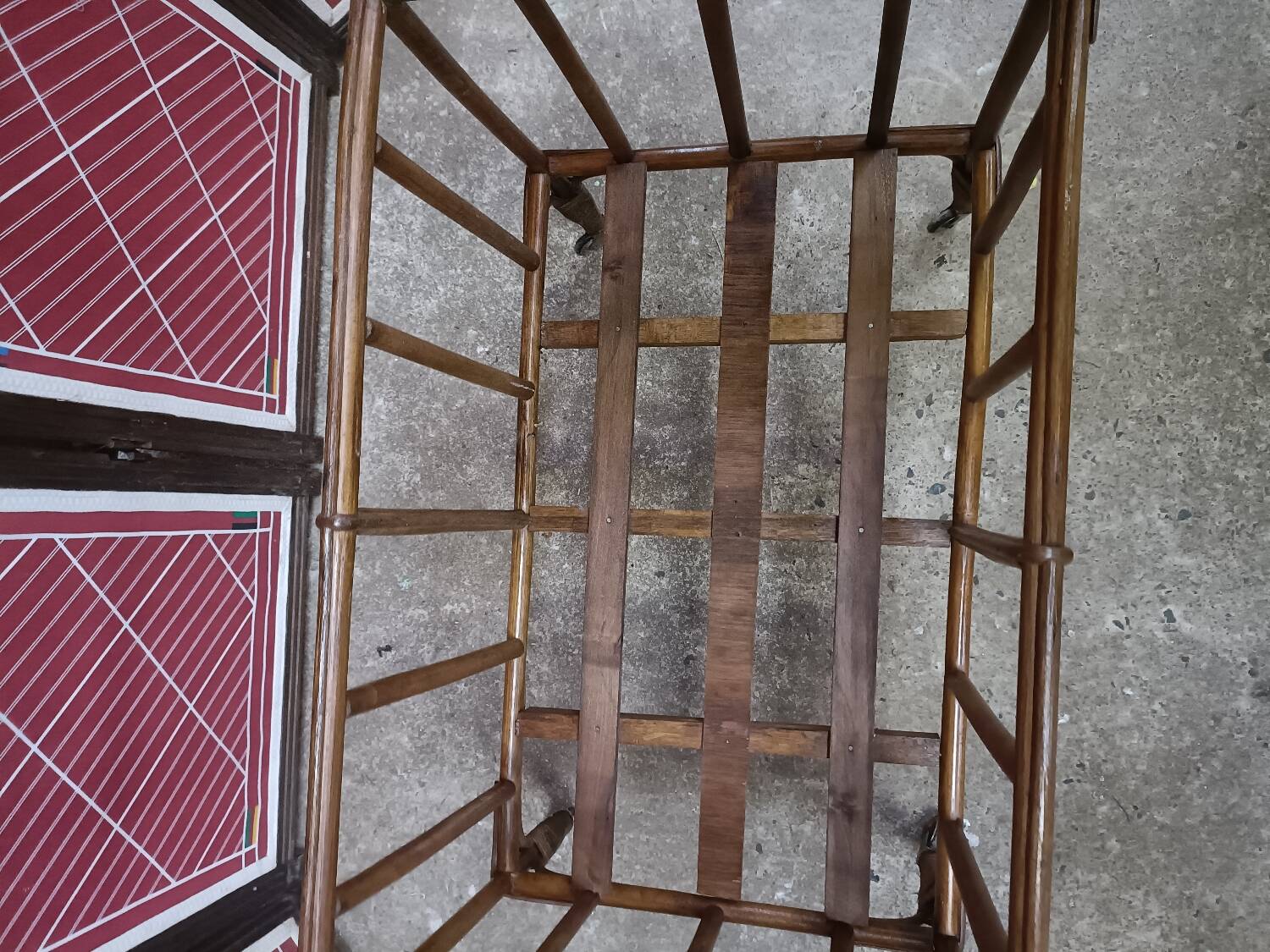 Old small bed or cradle for baby in vintage rattan