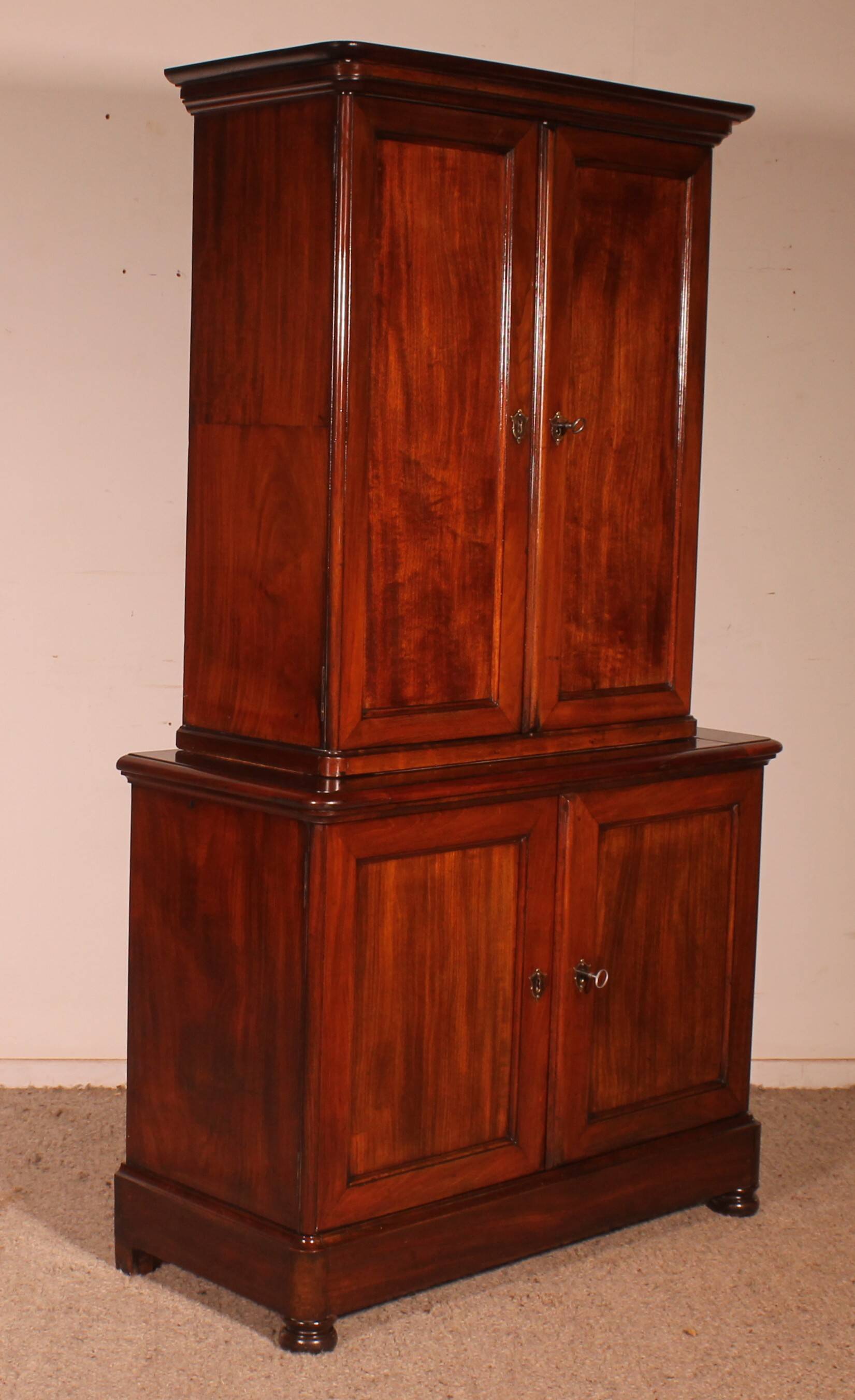 small two-body solid mahogany desk from the early 19th century with writing surface