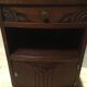 Solid oak bedside table with brown and white marble.