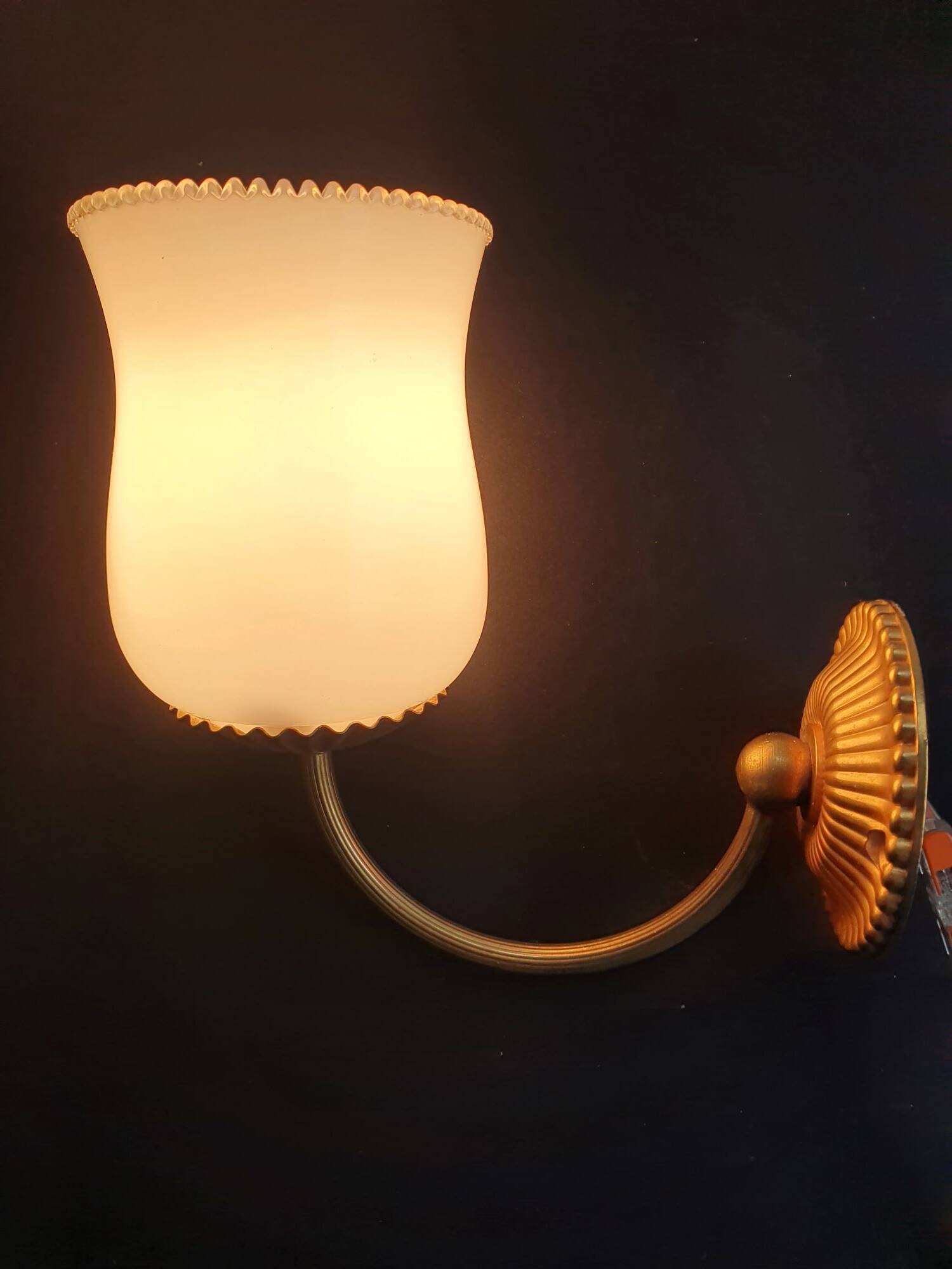 Pair of vintage gold-tone wall sconces with opaline glass globes