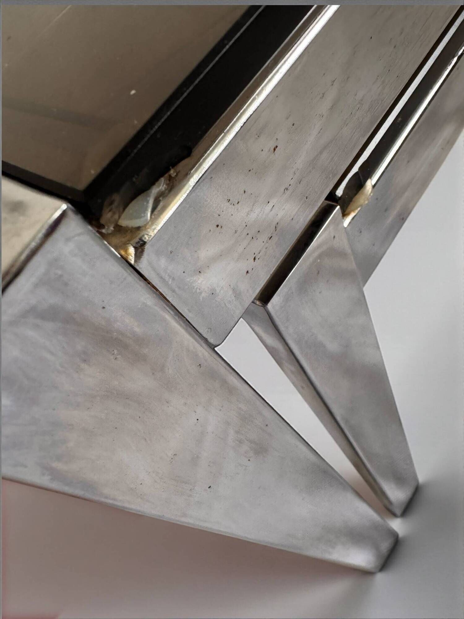 Vintage 1970s nesting tables in chrome and smoked glass, mid-century modernist style