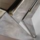 Vintage 1970s nesting tables in chrome and smoked glass, mid-century modernist style