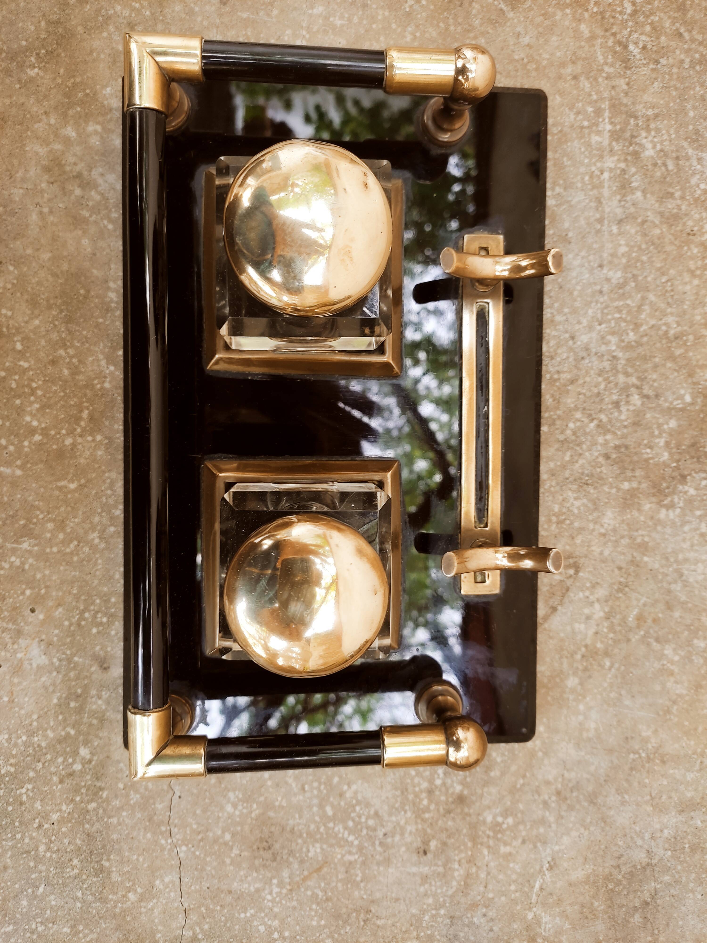 Hence the art deco inkwell on jet plate brass finishes