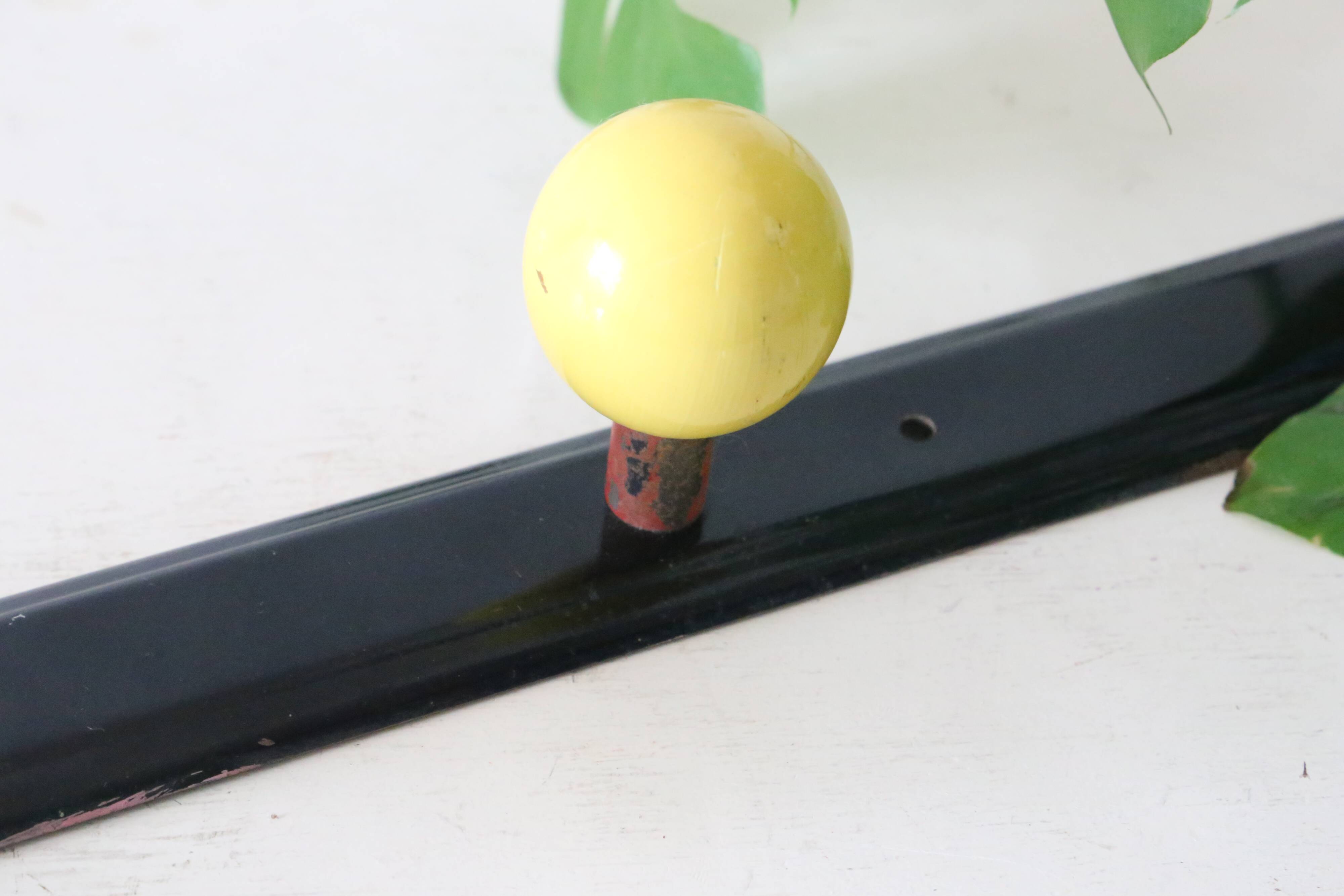 Wall-mounted coat rack, metal and colored wooden hook, 1960