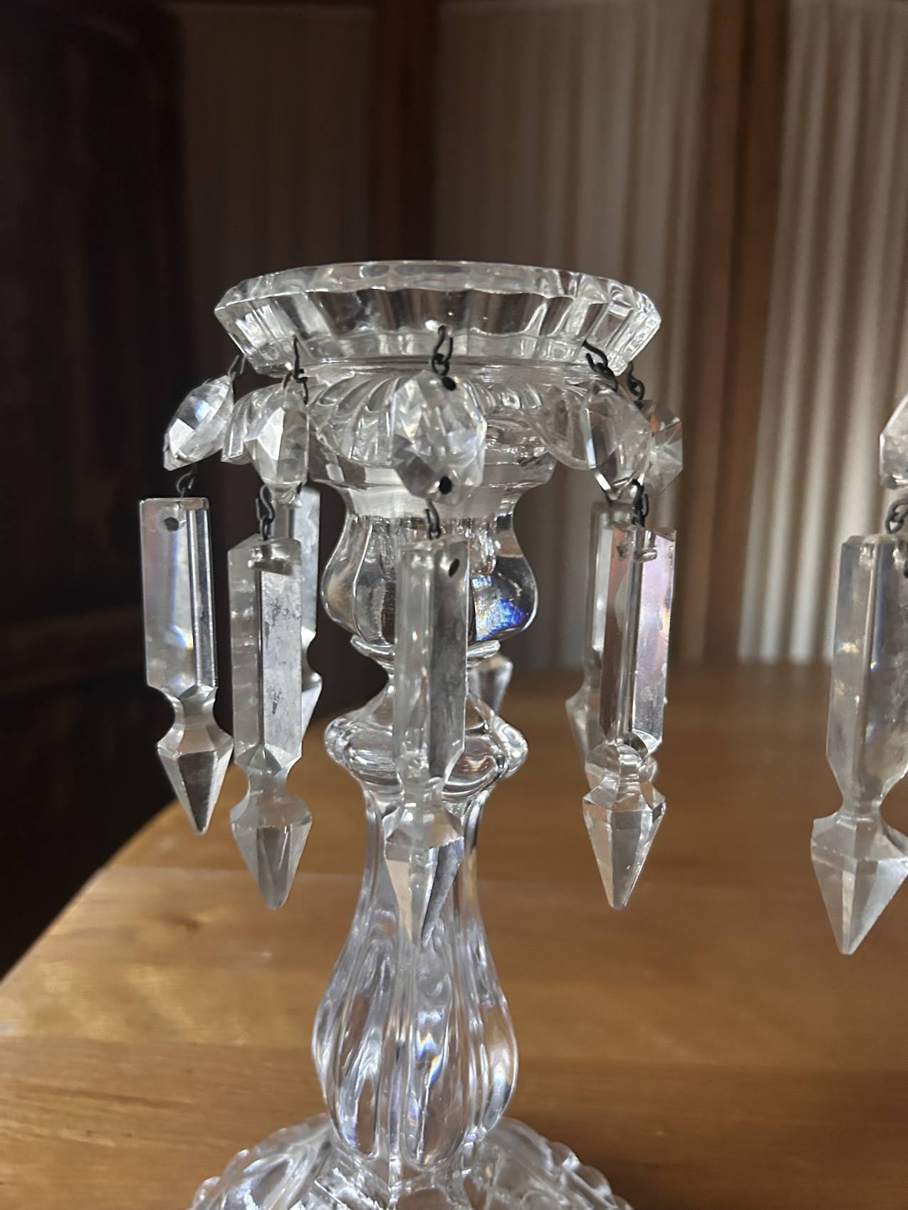 Pair of large Baccarat crystal candlesticks with pendants, a rare choice.